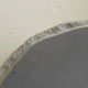 Honed dark grey granite with pitched edges Honed dark grey granite with pitched edges