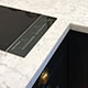 Honed Italian white marble, hob & splashback detail